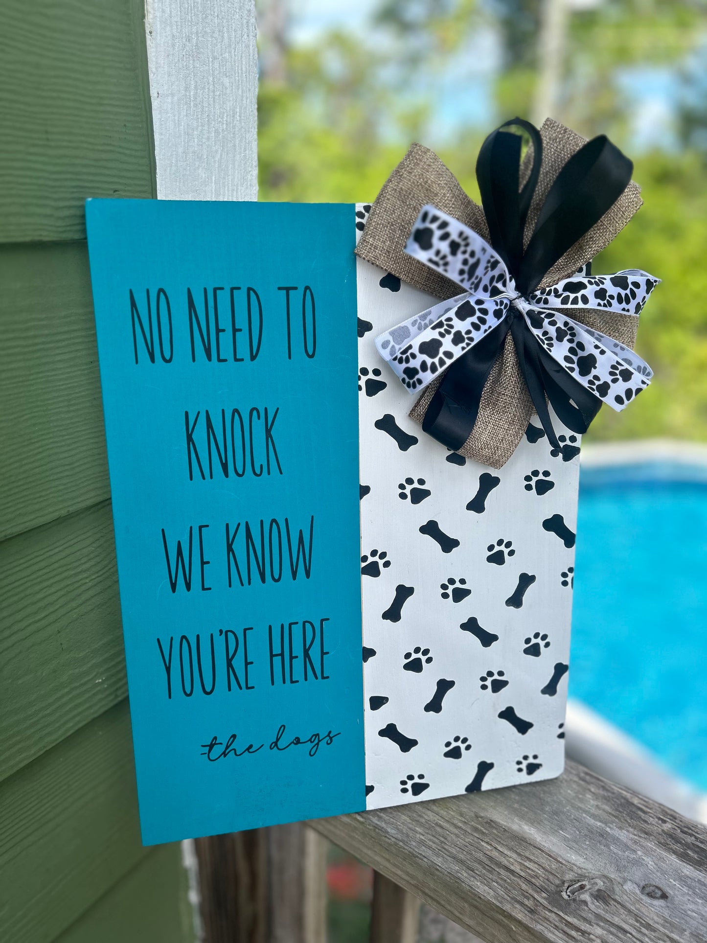 Wooden “no need to knock” front door sign